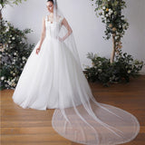 Bride long trailing pearl veil